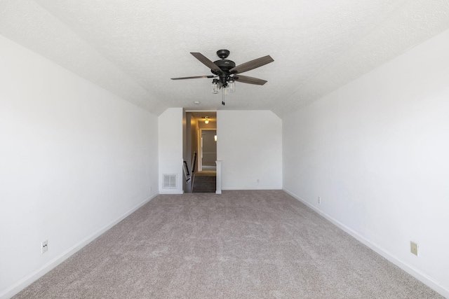 2981 Buckner Ln, Spring Hill, TN 37174 - carpeted empty room with vaulted ceiling, a ceiling fan, baseboards, and a textured ceiling