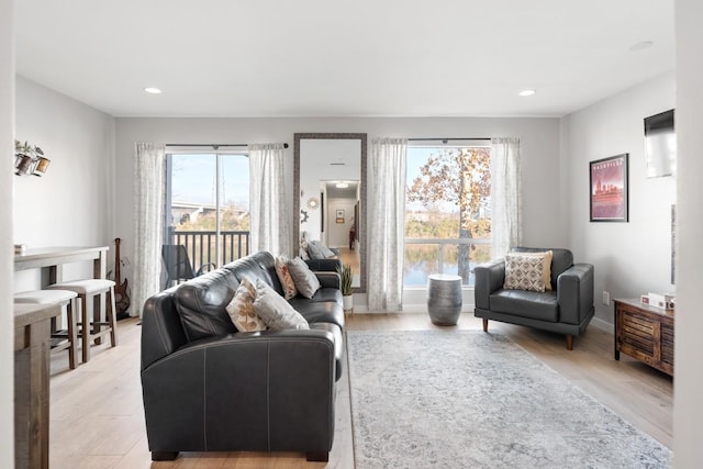 living room featuring light wood-style floors and recessed lighting
