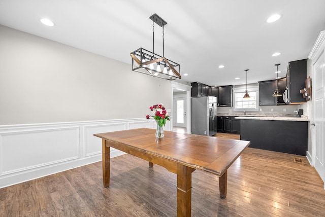 132 Fieldcrest Dr, Cadiz, KY 42211 - dining area featuring wainscoting, recessed lighting, wood finished floors, and a decorative wall