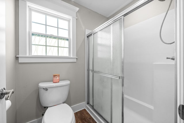 132 Fieldcrest Dr, Cadiz, KY 42211 - bathroom with a shower with shower door, toilet, wood finished floors, and baseboards