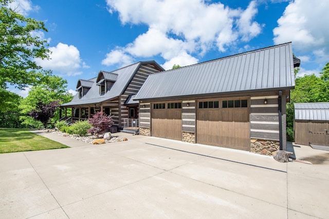 102 Highwater Rd, Waverly, TN 37185 - cabin featuring stone siding, a garage, and metal roof