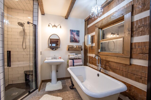 102 Highwater Rd, Waverly, TN 37185 - bathroom with a shower stall, a freestanding tub, beam ceiling, a chandelier, and baseboards