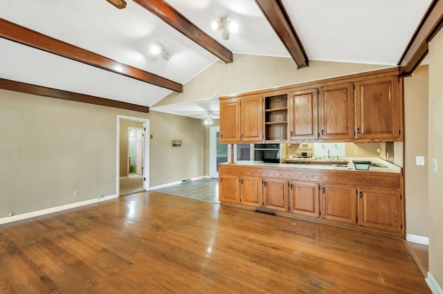 1033 Pine Valley Rd, Kingston Springs, TN 37082 - kitchen with open shelves, baseboards, light wood-style floors, and brown cabinetry