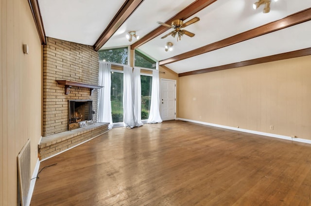 1033 Pine Valley Rd, Kingston Springs, TN 37082 - unfurnished living room featuring ceiling fan, wood finished floors, a brick fireplace, and baseboards