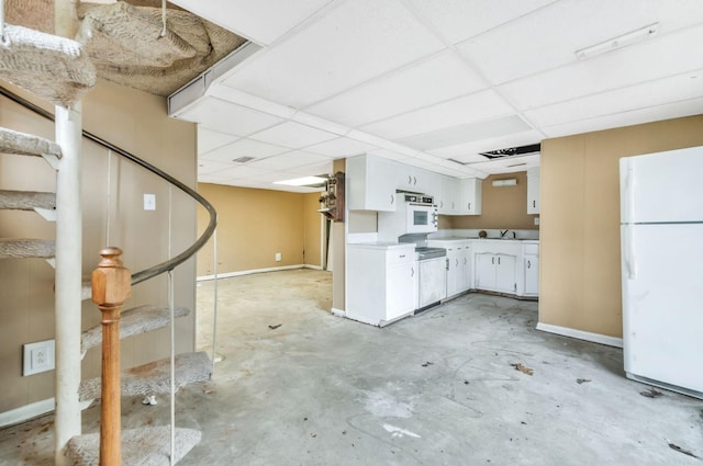 1033 Pine Valley Rd, Kingston Springs, TN 37082 - kitchen with freestanding refrigerator, white cabinets, a paneled ceiling, light countertops, and unfinished concrete floors