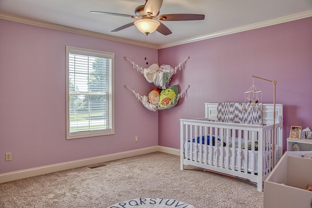 1570 Clemmons Rd, Cookeville, TN 38501 - unfurnished bedroom with a crib, carpet floors, baseboards, crown molding, and a ceiling fan