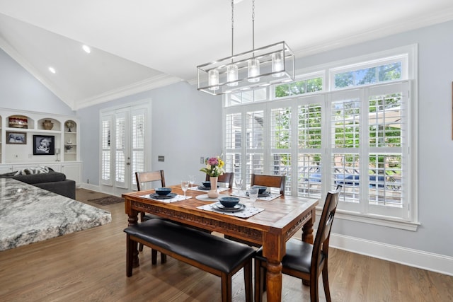 9702 Amethyst Ln, Brentwood, TN 37027 - dining area with a chandelier, ornamental molding, plenty of natural light, baseboards, and lofted ceiling