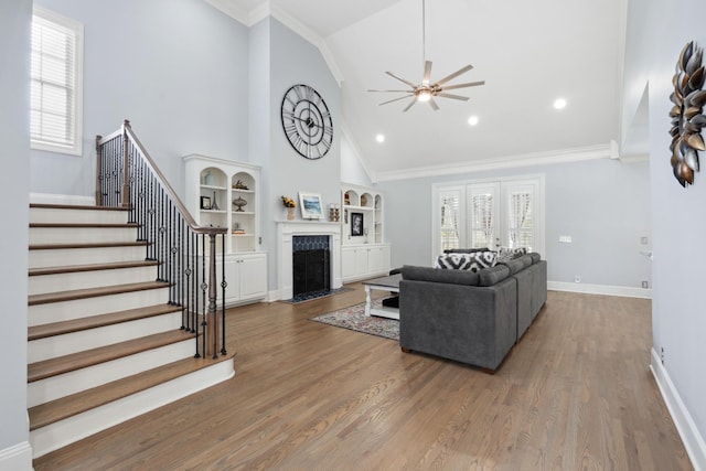 9702 Amethyst Ln, Brentwood, TN 37027 - living room with ceiling fan, stairway, healthy amount of natural light, high vaulted ceiling, and a premium fireplace