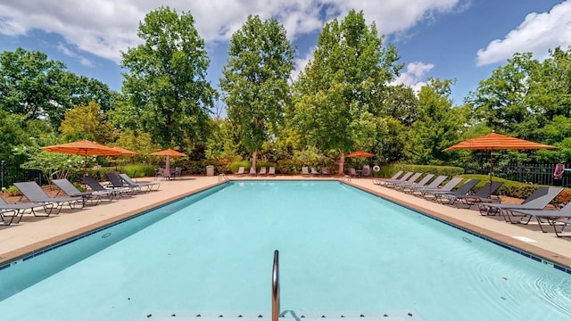 9702 Amethyst Ln, Brentwood, TN 37027 - community pool featuring a patio area, fence, and view of scattered trees
