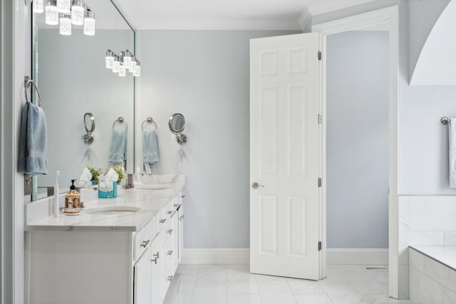 9702 Amethyst Ln, Brentwood, TN 37027 - bathroom featuring marble finish flooring, double vanity, baseboards, a bathtub, and a chandelier