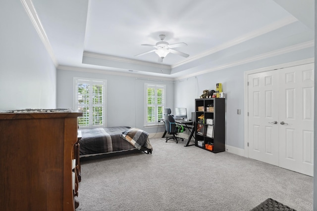 9702 Amethyst Ln, Brentwood, TN 37027 - carpeted bedroom featuring a tray ceiling, ornamental molding, ceiling fan, an office area, and baseboards