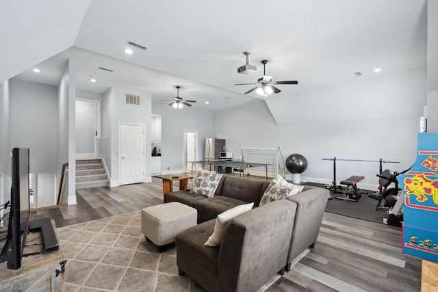 9702 Amethyst Ln, Brentwood, TN 37027 - living area with wood finished floors, stairway, baseboards, a ceiling fan, and vaulted ceiling