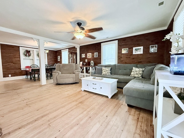 540 Grindstone Hollow Rd, Dickson, TN 37055 - living area featuring brick wall, a ceiling fan, light wood-type flooring, and crown molding