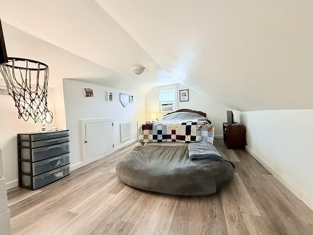 540 Grindstone Hollow Rd, Dickson, TN 37055 - bedroom with wood finished floors, vaulted ceiling, and baseboards