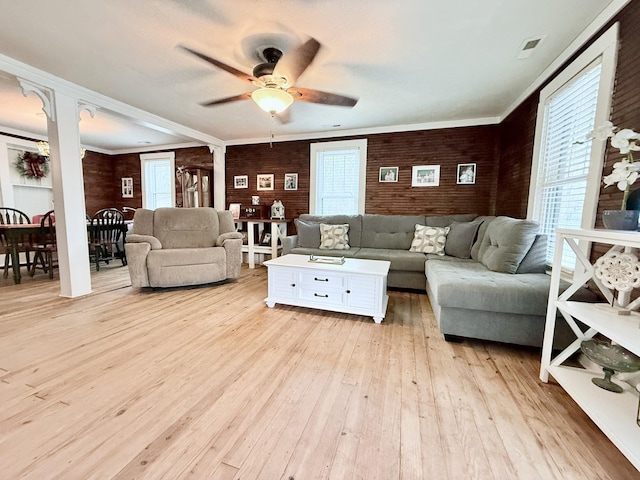 540 Grindstone Hollow Rd, Dickson, TN 37055 - living area with plenty of natural light, a ceiling fan, light wood finished floors, brick wall, and ornamental molding