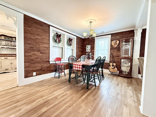 540 Grindstone Hollow Rd, Dickson, TN 37055 - dining room featuring a chandelier, wood finished floors, and wooden walls