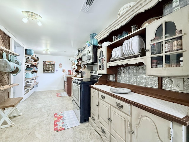 540 Grindstone Hollow Rd, Dickson, TN 37055 - kitchen with stainless steel appliances, open shelves, and baseboards