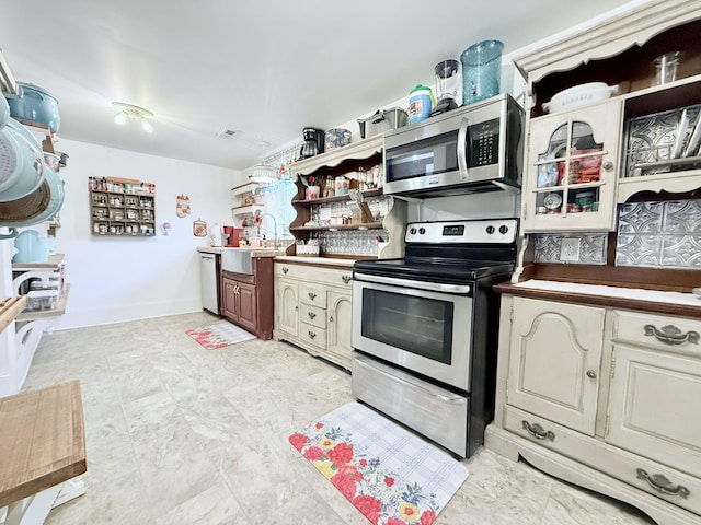 540 Grindstone Hollow Rd, Dickson, TN 37055 - kitchen with stainless steel appliances, open shelves, and a sink