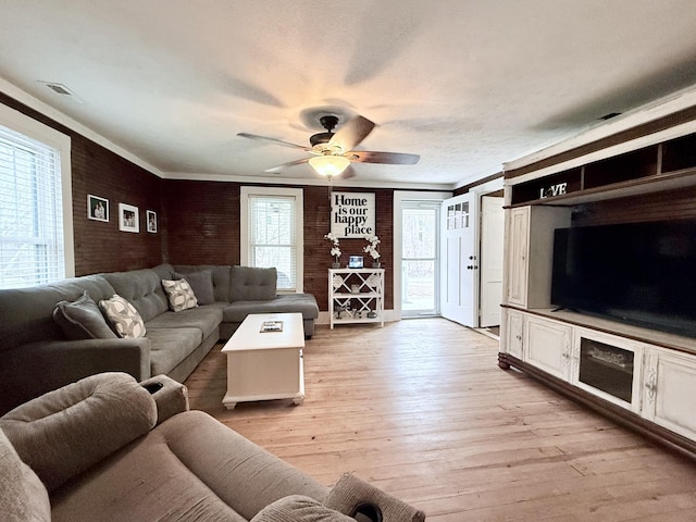 540 Grindstone Hollow Rd, Dickson, TN 37055 - living room featuring ceiling fan, light wood-style floors, and ornamental molding