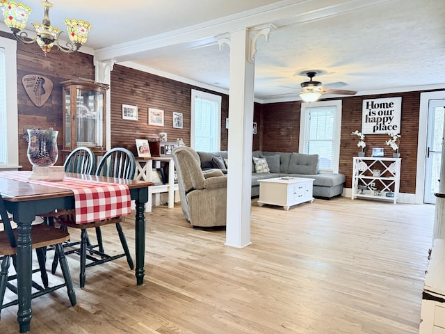 540 Grindstone Hollow Rd, Dickson, TN 37055 - dining area featuring healthy amount of natural light, light wood finished floors, a ceiling fan, a chandelier, and wood walls