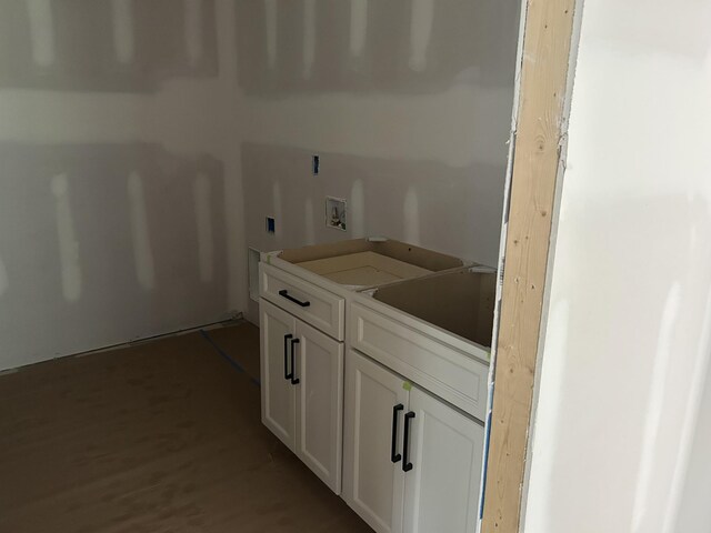 7321 Winners Rd, Murfreesboro, TN 37129 - washroom featuring wood finished floors, washer hookup, and cabinet space