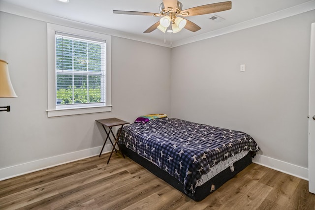 1301 Neelys Bend Rd Unit 50, Madison, TN 37115 - bedroom featuring wood finished floors, baseboards, ornamental molding, and ceiling fan