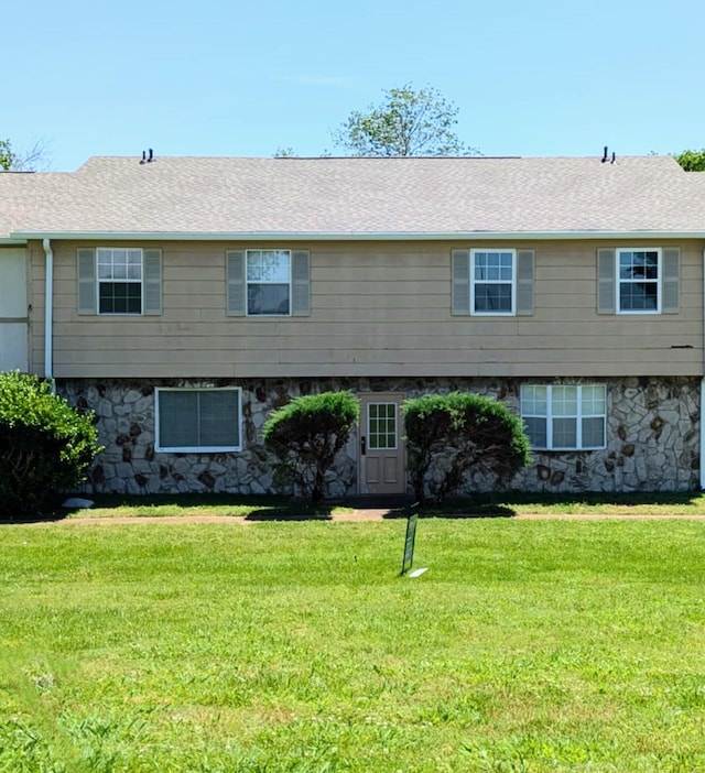 1301 Neelys Bend Rd Unit 50, Madison, TN 37115 - view of front of property with a front lawn, stone siding, and roof with shingles
