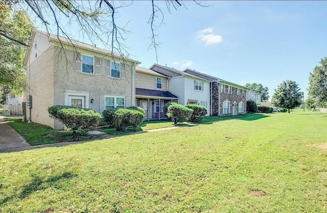 1301 Neelys Bend Rd Unit 50, Madison, TN 37115 - rear view of property featuring a yard and brick siding