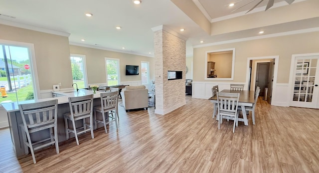514 Rohan Dr, Murfreesboro, TN 37129 - dining space featuring ornamental molding, light wood-style floors, wainscoting, a fireplace, and recessed lighting
