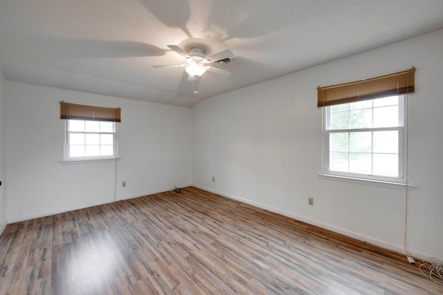 102 Hobbs Ridge Rd, Dunlap, TN 37327 - empty room featuring light wood-type flooring, a ceiling fan, a textured ceiling, and baseboards