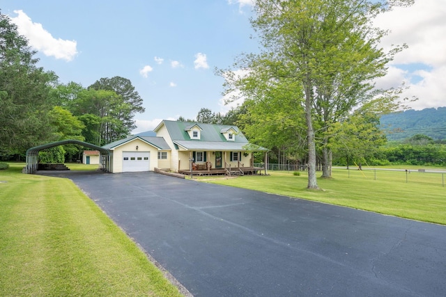 102 Hobbs Ridge Rd, Dunlap, TN 37327 - view of front of home featuring covered porch, asphalt driveway, and a carport