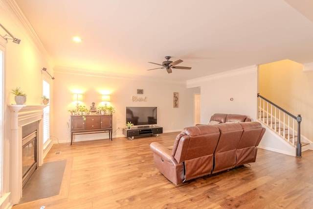 2004 Towhee Ct, Spring Hill, TN 37174 - living room with a ceiling fan, ornamental molding, stairway, light wood-type flooring, and a fireplace