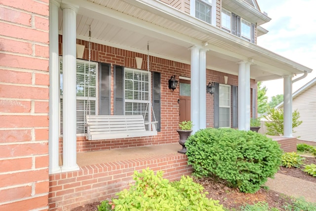 2004 Towhee Ct, Spring Hill, TN 37174 - property entrance with a porch and brick siding