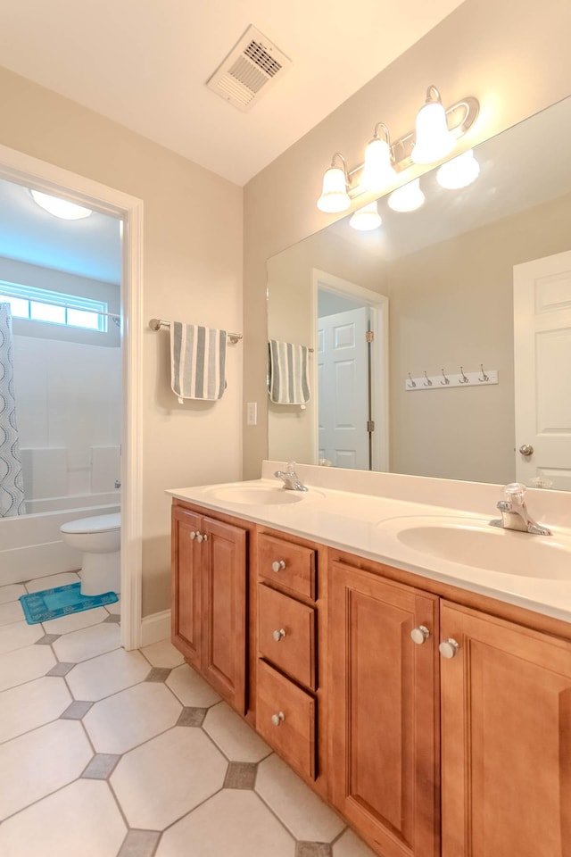 2004 Towhee Ct, Spring Hill, TN 37174 - bathroom featuring double vanity, tile patterned floors, shower / bath combo, and toilet
