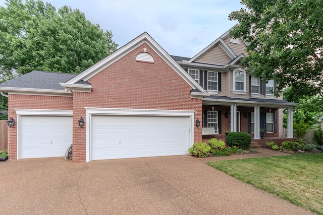 2004 Towhee Ct, Spring Hill, TN 37174 - view of front of property with brick siding, driveway, and a porch