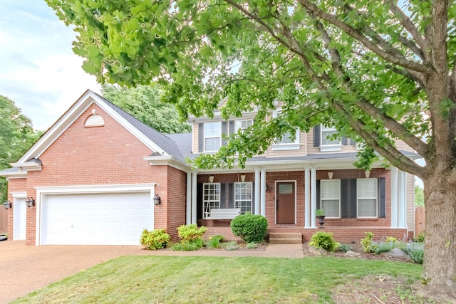 2004 Towhee Ct, Spring Hill, TN 37174 - view of front of house with a garage, brick siding, driveway, and a porch