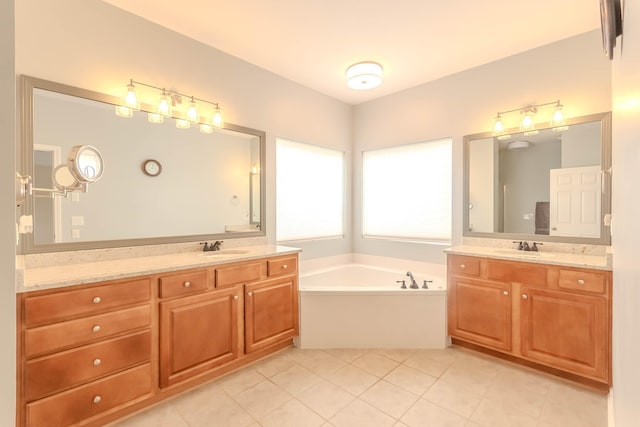 2004 Towhee Ct, Spring Hill, TN 37174 - full bathroom featuring two vanities, a bath, and tile patterned floors