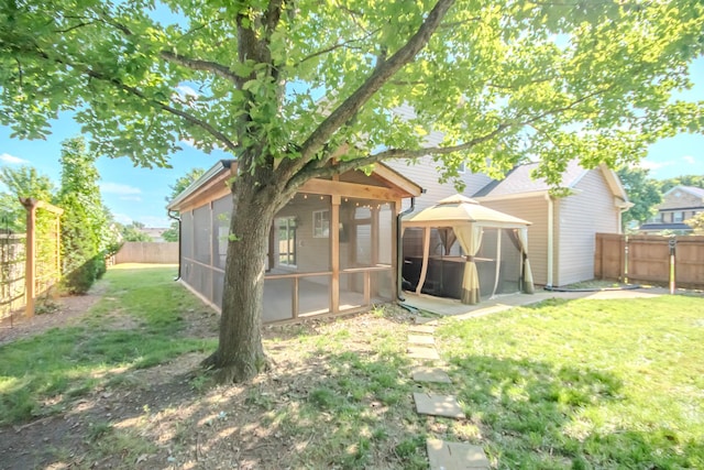 2004 Towhee Ct, Spring Hill, TN 37174 - back of property featuring a sunroom and a gazebo
