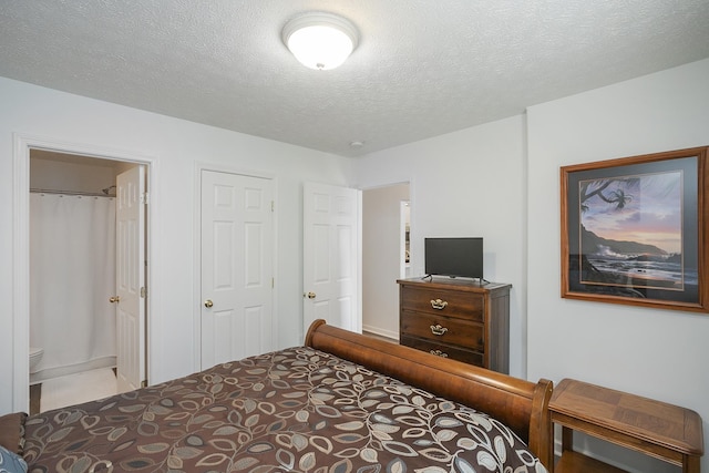 bedroom featuring a textured ceiling