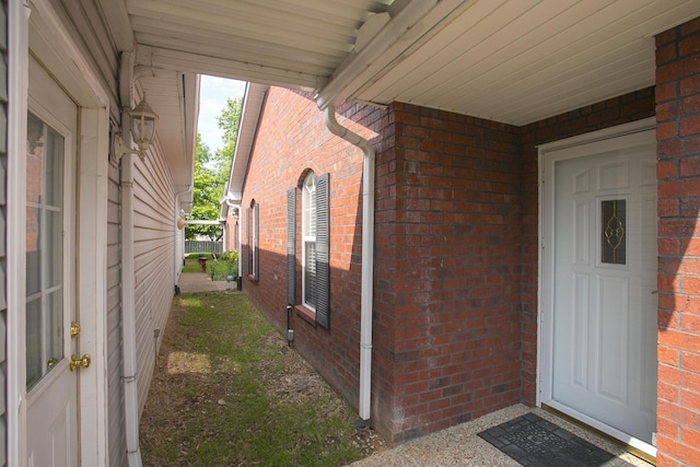 property entrance with brick siding