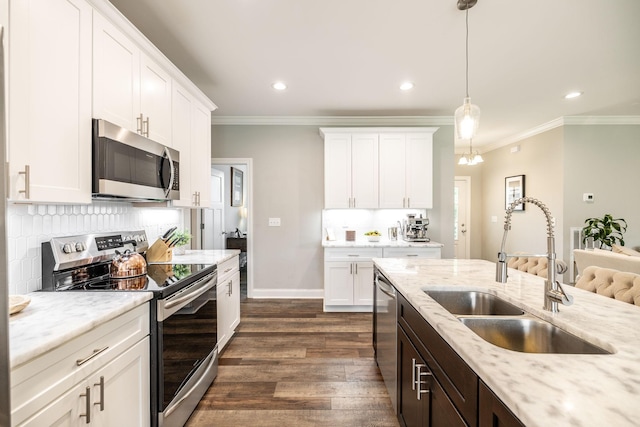 1551 Dobbins Pike, Gallatin, TN 37066 - kitchen featuring appliances with stainless steel finishes, a sink, dark wood-style flooring, white cabinetry, and ornamental molding