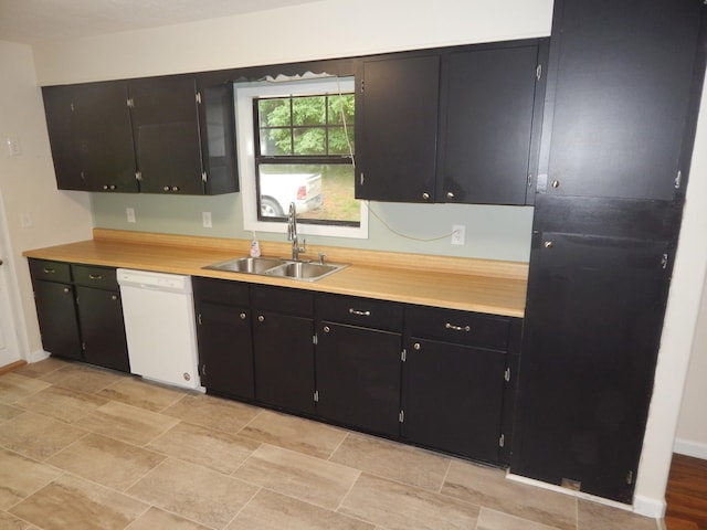 3355 Willie Mauldon Rd, Lutts, TN 38471 - kitchen featuring dishwasher, a sink, light countertops, dark cabinetry, and baseboards
