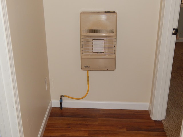 3355 Willie Mauldon Rd, Lutts, TN 38471 - detailed view of wood finished floors, baseboards, and heating unit