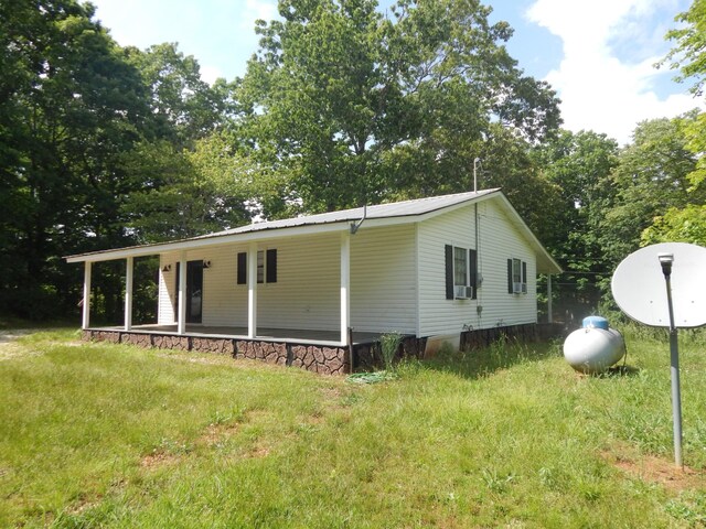 3355 Willie Mauldon Rd, Lutts, TN 38471 - view of front facade featuring metal roof and cooling unit