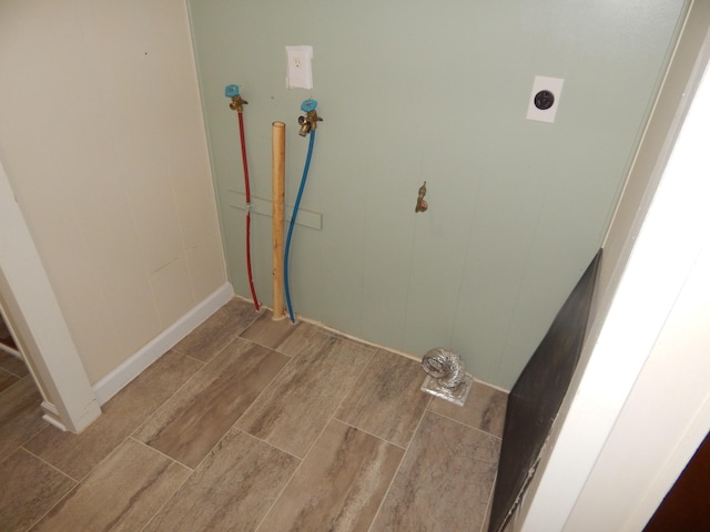 3355 Willie Mauldon Rd, Lutts, TN 38471 - washroom with wood finished floors, hookup for a washing machine, and baseboards
