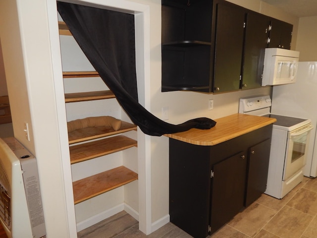3355 Willie Mauldon Rd, Lutts, TN 38471 - kitchen featuring white appliances, light countertops, and light tile patterned flooring