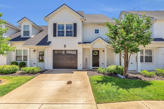 3507 Learning Ln, Murfreesboro, TN 37128 - view of front facade featuring driveway, a shingled roof, a garage, brick siding, and a front yard