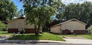 view of home's exterior with a lawn