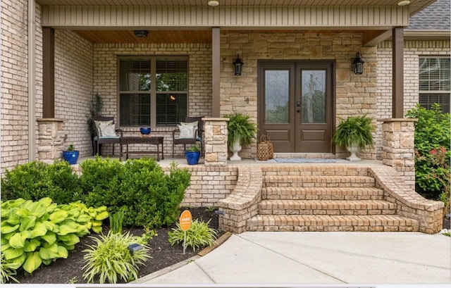 4999 Crescent Ln, Murfreesboro, TN 37128 - view of exterior entry featuring covered porch, french doors, and brick siding