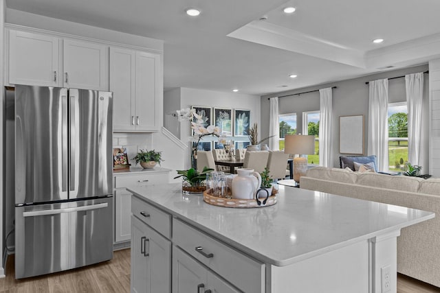 2481H Hamilton Ln, Lebanon, TN 37087 - kitchen featuring freestanding refrigerator, open floor plan, light wood finished floors, a kitchen island, and recessed lighting